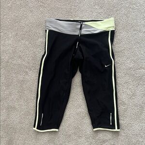 Nike women’s Black and Gray Leggings with Yellow Accents